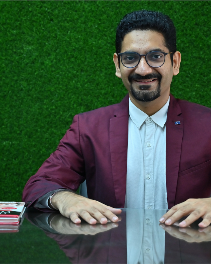 Vishal Manocha today, in a maroon blazer